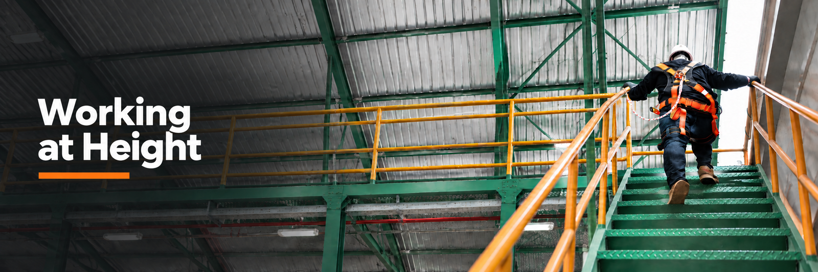 working at height banner showing someone where a harness and lanyard