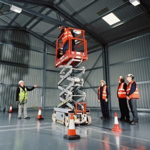 Scissor lift training instructor showing delegates how to use a 3a