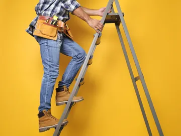 Climbing a ladder using safe techniques learnt from training